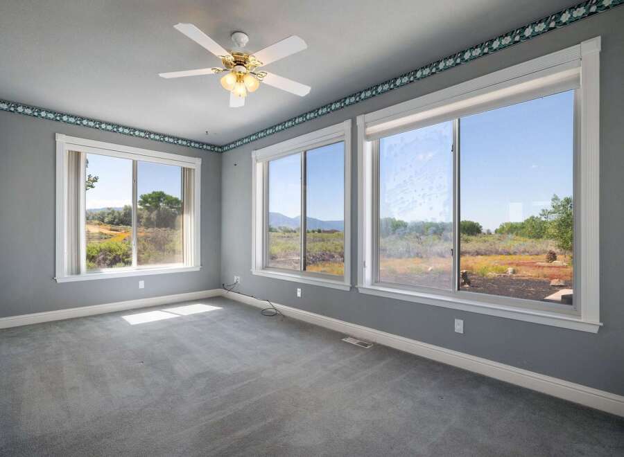 Experience breathtaking views from this spacious room, featuring large windows that flood the space with natural light.
