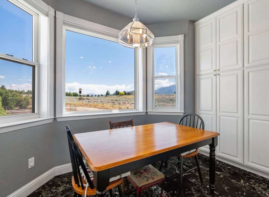 Enjoy breathtaking mountain views from this charming breakfast nook, perfect for morning coffee or intimate meals.