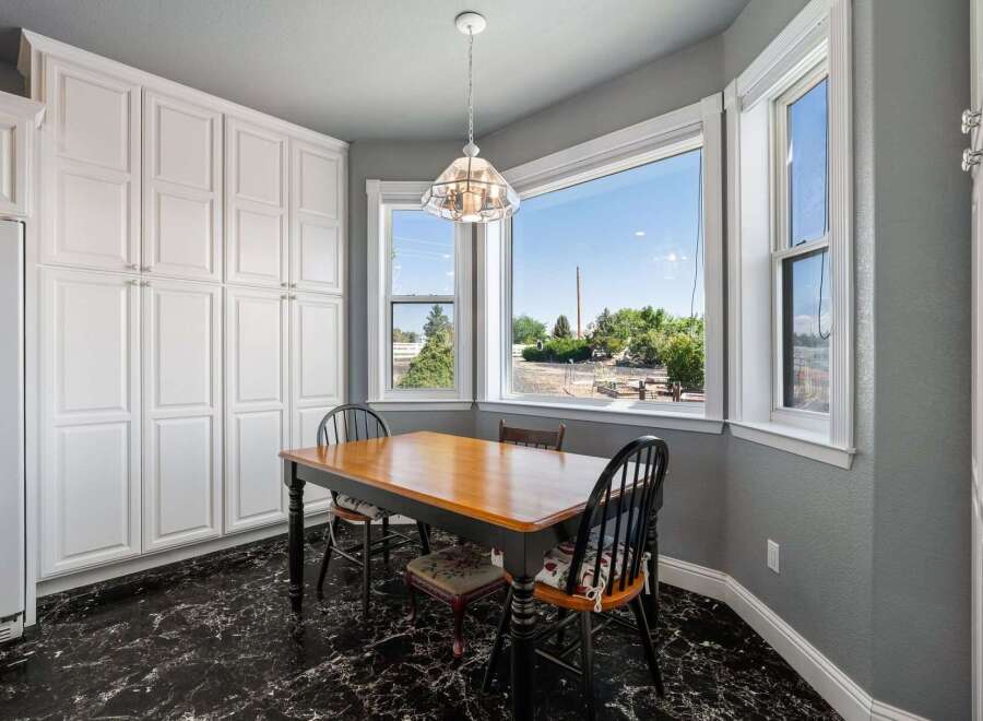 Enjoy meals with a view in this charming dining area, featuring a bay window that floods the space with natural light.