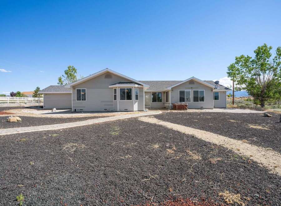 Discover this charming single-story home featuring a spacious layout and a welcoming ambiance.