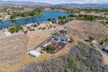 Discover this stunning property offering a serene lakefront lifestyle with a spacious home and ample land.