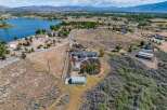 Discover this expansive property featuring a stunning lakefront view and a spacious main residence.