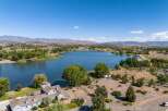 Experience lakeside living at its finest with this stunning property offering panoramic views of the serene blue water.