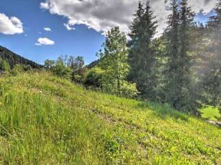 Discover this stunning property nestled amidst lush greenery and rolling hills.