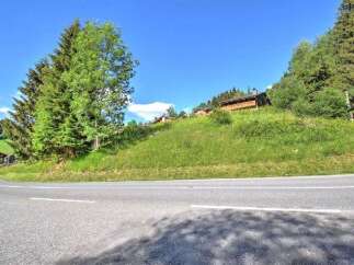 Discover this charming property nestled on a picturesque hillside, offering breathtaking views of the surrounding alpine landscape.