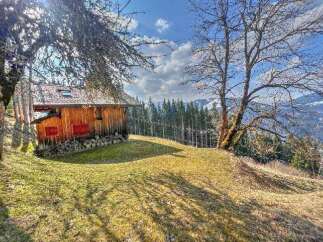 Discover this charming rustic cabin nestled amidst breathtaking mountain views.