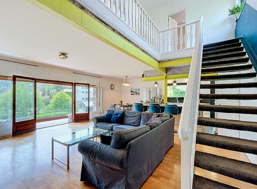 Experience modern living in this spacious open-concept apartment featuring a stunning multi-level design.