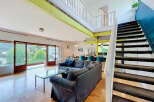 Experience modern living in this spacious open-concept apartment featuring a stunning multi-level design.