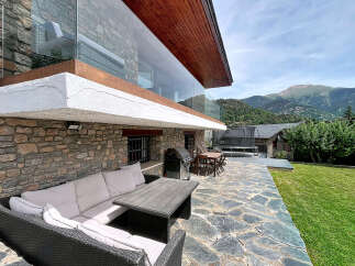 Experience outdoor living at its finest with this stunning property featuring a spacious stone patio perfect for entertaining.