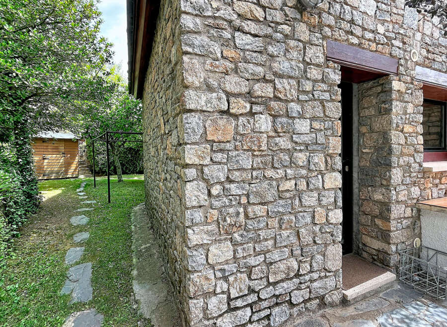 Discover this charming stone-built property, featuring rustic stonework and a welcoming entrance.