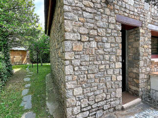 Discover this charming stone-built property, featuring rustic stonework and a welcoming entrance.