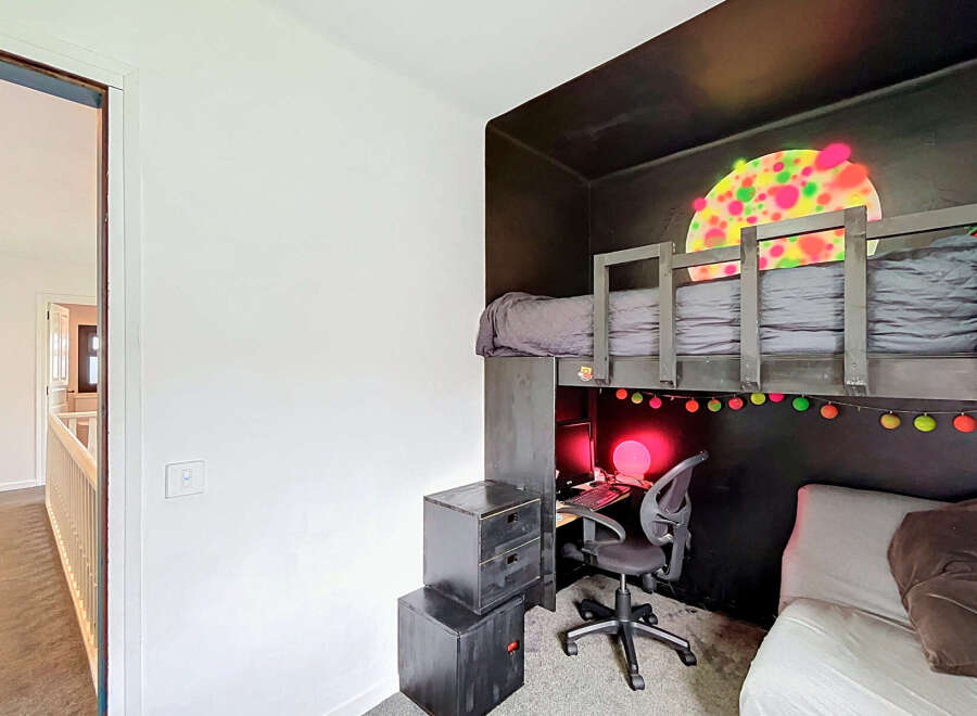 Discover this unique loft bed setup, perfect for maximizing space in a child's room.