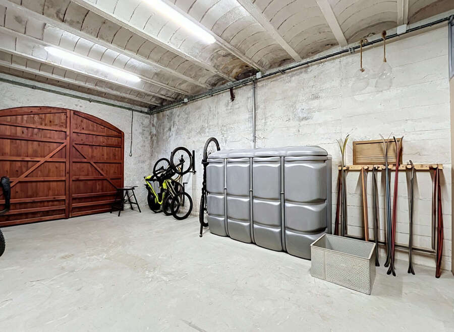 Discover ample storage and organization solutions in this versatile garage space.