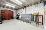 Discover ample storage and organization solutions in this versatile garage space.