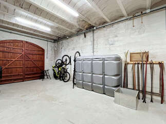 Discover ample storage and organization solutions in this versatile garage space.