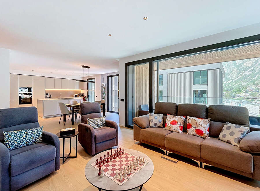 Experience modern living in this spacious open-plan apartment, featuring a sleek, integrated kitchen with state-of-the-art appliances and a dining area perfect for entertaining.