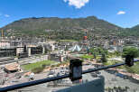 Experience urban living with a mountain backdrop in this vibrant city view.