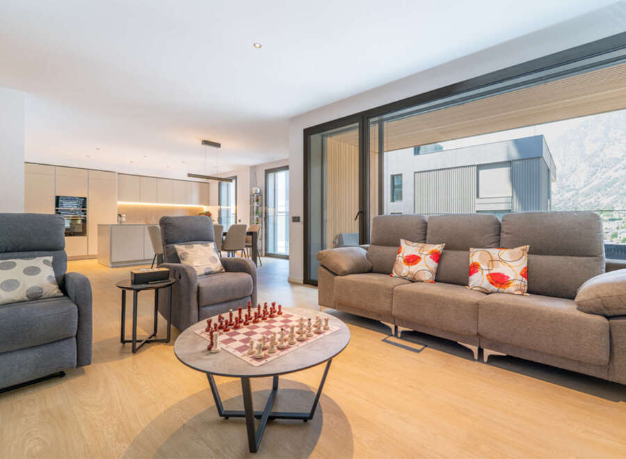 Experience modern living in this spacious open-concept home, featuring a sleek kitchen and a comfortable living area perfect for relaxation and entertainment.