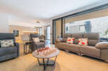 Experience modern living in this spacious open-concept home, featuring a sleek kitchen and a comfortable living area perfect for relaxation and entertainment.