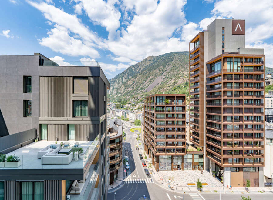 Experience modern urban living in this stunning apartment complex, featuring sleek architecture and breathtaking mountain views.