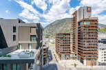Experience modern urban living in this stunning apartment complex, featuring sleek architecture and breathtaking mountain views.