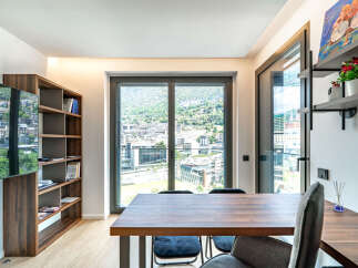 Experience modern living with this stunning apartment featuring a spacious dining area perfect for entertaining.