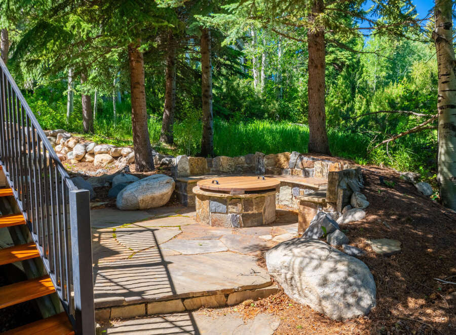 Discover this enchanting outdoor living space, perfect for entertaining or relaxing amidst nature.