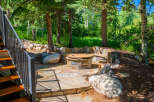 Discover this enchanting outdoor living space, perfect for entertaining or relaxing amidst nature.