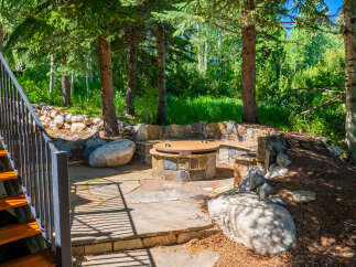 Discover this enchanting outdoor living space, perfect for entertaining or relaxing amidst nature.