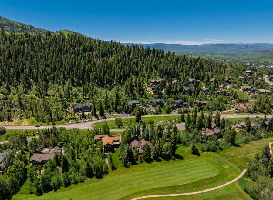 Experience luxury mountain living in this stunning property nestled amidst a lush pine forest.