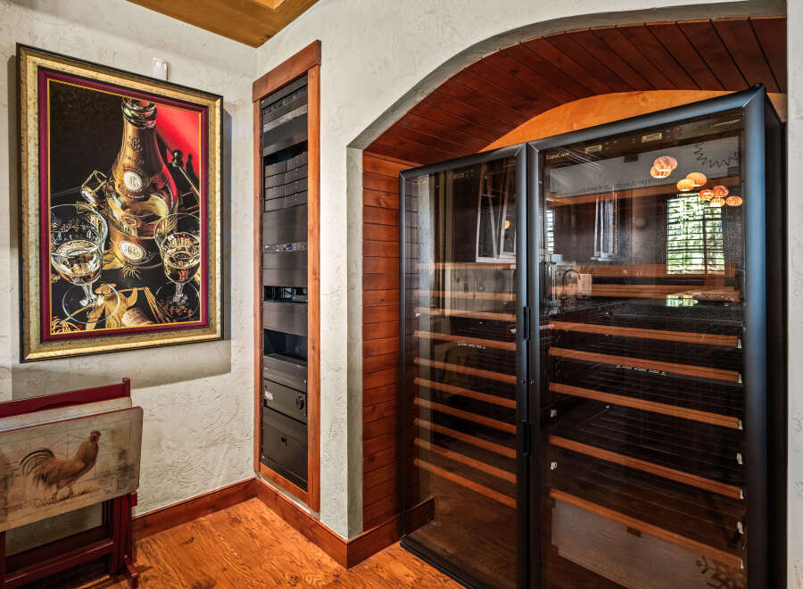 Experience the ultimate in wine preservation with this state-of-the-art wine cellar, featuring dual-zone temperature control and ample shelving.