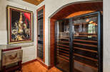 Experience the ultimate in wine preservation with this state-of-the-art wine cellar, featuring dual-zone temperature control and ample shelving.