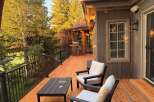 Enjoy the stunning mountain views from this expansive wooden deck, perfect for outdoor entertaining.
