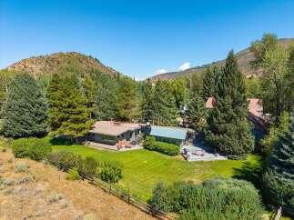 Nestled amidst a serene mountain landscape, this property offers a tranquil retreat with stunning natural beauty.