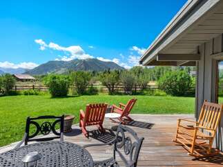 Enjoy breathtaking mountain views from this expansive deck, perfect for outdoor entertaining or quiet relaxation.
