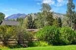 Nestled amidst lush greenery and mature trees, this property offers a serene mountain retreat.