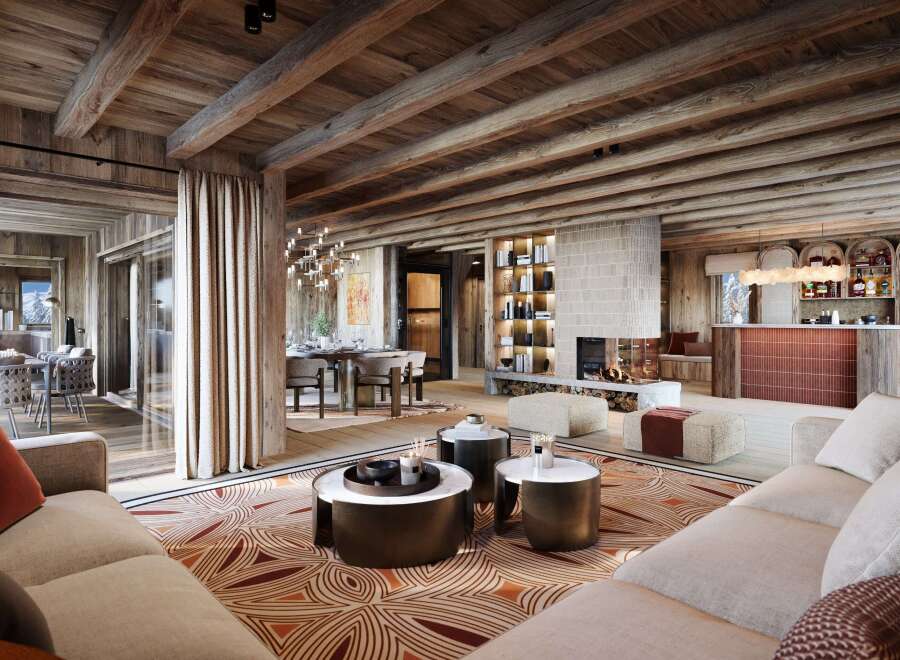 Experience luxury mountain living in this stunning chalet, featuring a grand living area with a modern fireplace and a fully equipped bar.
