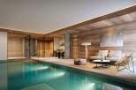 Experience ultimate relaxation in this luxurious indoor spa featuring a stunning swimming pool and a modern sauna.