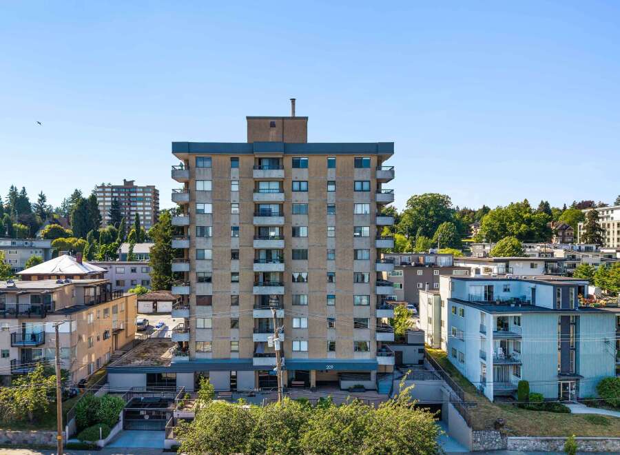 Discover this charming apartment building, featuring a classic mid-rise design with multiple balconies offering city views.