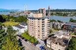 Discover this prime real estate opportunity featuring a multi-story apartment building with balconies and ample parking.