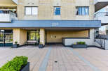Discover modern living at this apartment building featuring a clean, contemporary facade with large windows and balconies.