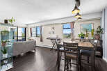 Experience modern living in this spacious condo featuring a bright and airy living and dining area.