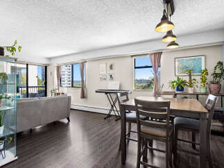 Experience modern living in this spacious condo featuring a bright and airy living and dining area.
