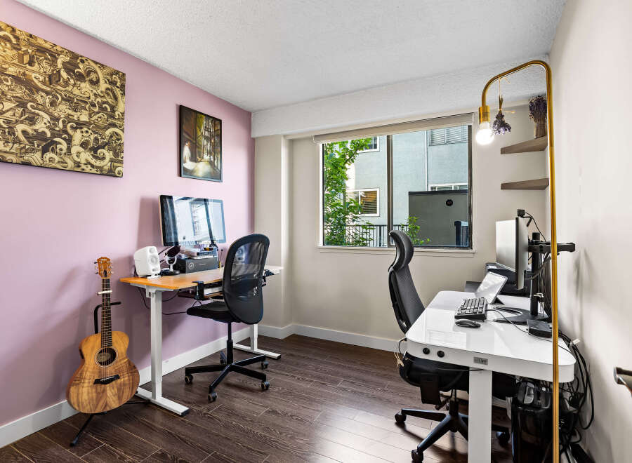 This home office features two distinct workspaces, perfect for collaboration or individual focus.