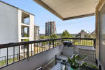 Enjoy outdoor living on this spacious balcony, perfect for entertaining or relaxing with a view.