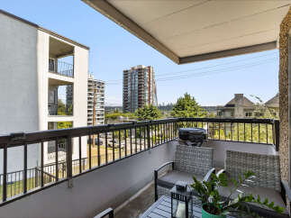 Enjoy outdoor living on this spacious balcony, perfect for entertaining or relaxing with a view.