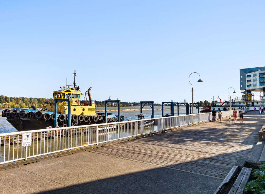 Enjoy waterfront living with this stunning property featuring a scenic boardwalk perfect for leisurely strolls and a vibrant marina.