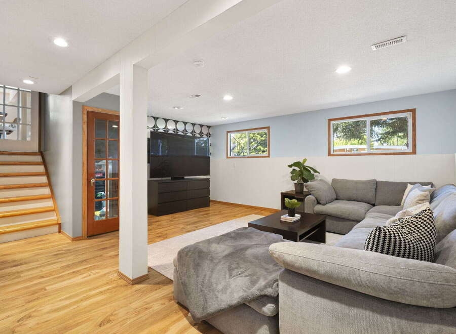 Discover comfortable living in this inviting finished basement, perfect for relaxation and entertainment.