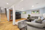 Discover comfortable living in this inviting finished basement, perfect for relaxation and entertainment.