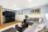 This basement living area offers a modern and comfortable entertainment space.